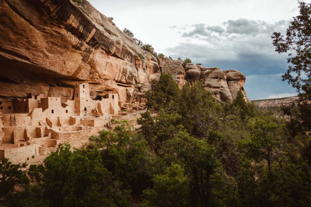 Ancient buildings by the Ancestral Pueblo people built into the mountain